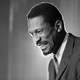 Bill Russell grins at the announcement that he had been named coach of the Boston Celtics basketball team, on April 18, 1966. The NBA great Bill Russell died at age 88.